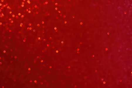 A red background with small orange spots scattered across itの写真素材