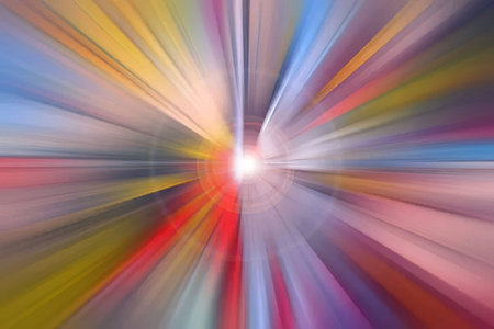An abstract image featuring a bright light at the center, surrounded by vibrant colors radiating outward in a dynamic, starburst-like pattern.の写真素材