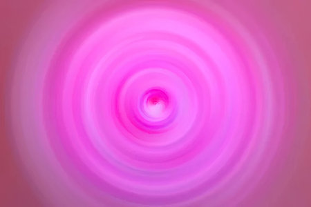 A mesmerizing image featuring concentric pink circles with a gradient effect, creating a swirling pattern that draws the viewer's eye to the center.の写真素材