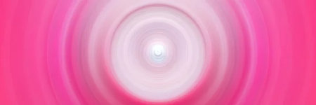 A pink background with white circles and a bright center