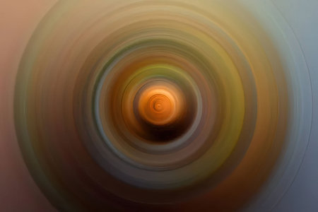 Vibrant abstract spiral effect swirls in dynamic motion creating a mesmerizing visual experience with a blend of warm and cool colors.の写真素材