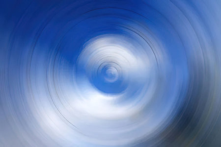 Blue and white abstract spiral pattern swirls creating a dynamic circular motion effect symbolizing...