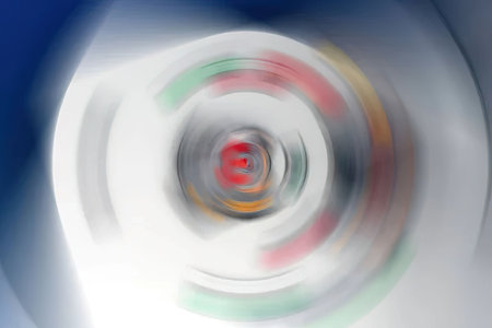 Vibrant abstract spiral pattern swirls with red and green hues creating a mesmerizing visual effect...