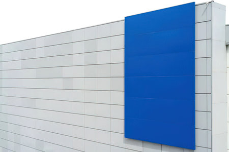 Bright blue board on a grey tiled building facade for blank signage or branding purposes.