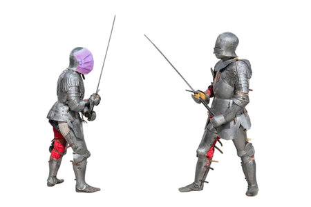 Two armored men engage in a fierce duel with swords on a white background facing each other,...