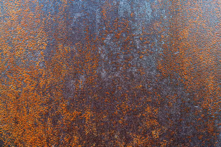 Gradient rusty metal surface with rough texture and corroded finish, featuring earthy tones and an...