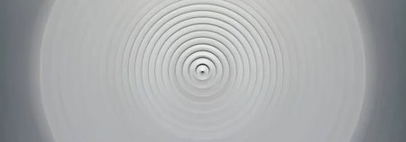 White spiral pattern on a gray background featuring concentric circles that create a visually...