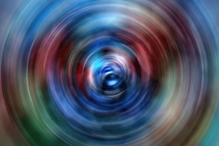 Vibrant abstract spiral pattern swirls with blended blue, red, and green colors creating a dynamic...