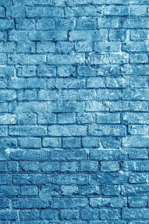 Blue painted brick wall texture background featuring a grungy and worn surface perfect for design...