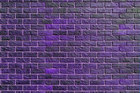 Dark purple brick wall features textured surface and visible mortar lines, creating a rustic urban...