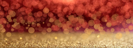 Gold and red bokeh lights blend together creating a festive atmosphere with a luxurious and...