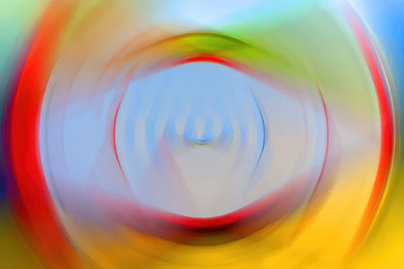 Swirling colorful abstract art creates a dynamic visual effect with blurred circles and vibrant colors.の写真素材