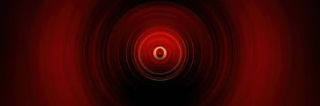 Bright red abstract background features glowing circular rings and vibrant central light effect for...