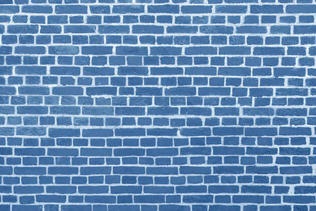 Cobalt blue brick wall texture providing a striking background with visible mortar and slight...