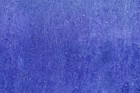 Blue grungy textured background featuring speckles and grunge elements, ideal for creative design...