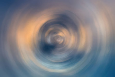 Swirling vortex of colors creates a mesmerizing abstract background image with a dynamic spiral...