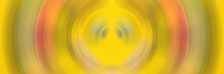 Bright yellow background with swirling orange and green circular motion creating a vibrant abstract design ideal for modern digital art and creative wallpapers.の写真素材