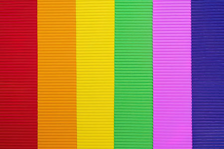 Rainbow colored fabric texture featuring vibrant red, orange, yellow, green, pink, and blue vertical...