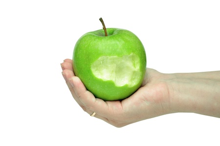 green apple on a female handの写真素材