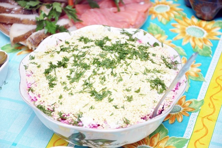 Herring under a fur coat on a festive tableの写真素材