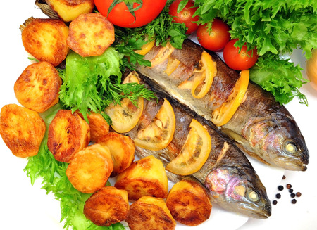 grilled trout with  vegetables and lemonの写真素材