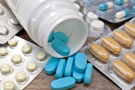 medical pills on a wooden table