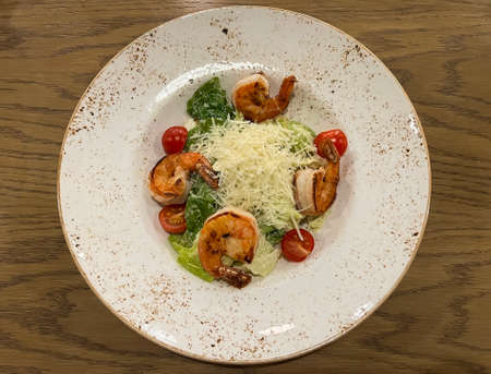 Caesar salad with shrimps and parmesan cheeseの写真素材