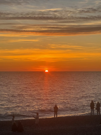 Red sun setting over the seaの写真素材