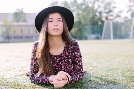Girl in dress posing in the stadiumの写真素材