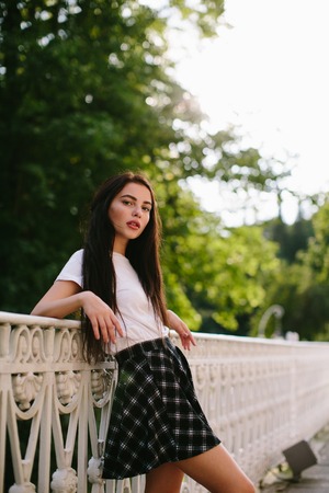 Attractive girl in dress posing outdoorの写真素材