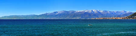 panoramic view of Mediterranean Sea of snowly mountain and cityの写真素材