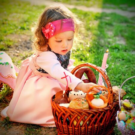 little girl with Easter basket of consecration of the church circle Ternopil, Ternopil, Ukraine 04 April 2013:のeditorial素材