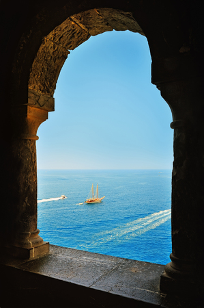 arcade window and view of the sea with yachtの写真素材