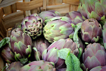 italian artichokes in wicker basket macroの写真素材