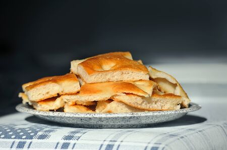 plate of slices Foccacia Italian bread on the table