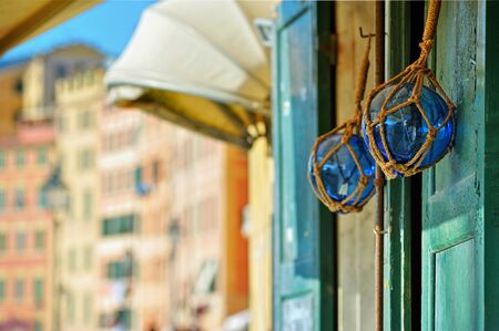 two glasses buoys on wood door at the street blured background