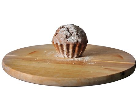 cupcake on wooden board with white background and pathsの写真素材