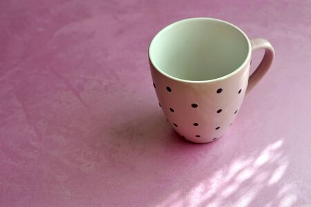 cup on a lilac pearl backgroundの写真素材
