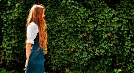 autumn portrait natural redhead girl with wild grape wall