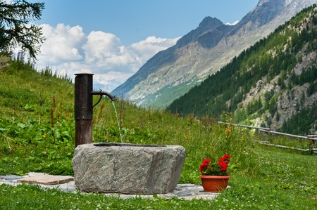 old well at the european alpsの写真素材
