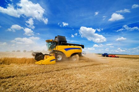 close view of modern combine harvester in action. Harvesting and arable industry in Ukraineの写真素材