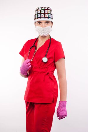 Female attractive doctor with a stethoscope smiling standing on white backgroundの写真素材