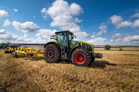 tractor with disc harrow, soil cultivation system in operation