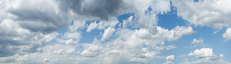 panorama of clouds against the blue sky. background, wallpaper. Gradient transition from dark to...