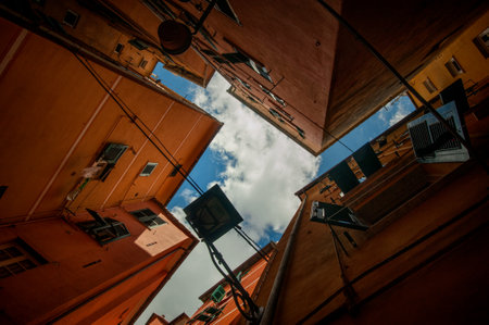 narrow, colorful streets, lanterns and courtyards, bottom view, geometry of facades, Liguria, Genoa, Italyの写真素材