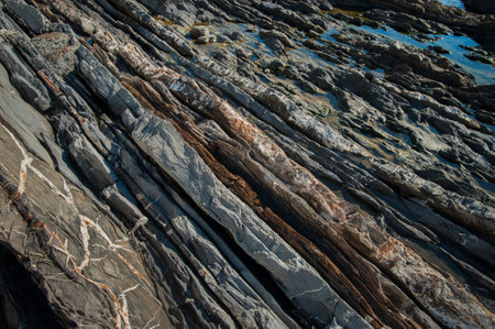 Geological layers of stones of the mountain, various rock formations and layers on the rocks of the...