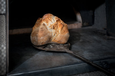 Homemade sourdough bread, nicely baked with a crust, The process of baking artisanの写真素材
