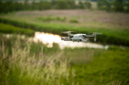 mini drone in the air at sunset or sunrise, explores floodplain of Seret River territories from the...