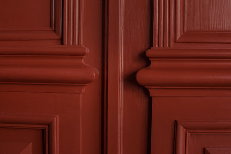 Close up of carved three-dimensional elements of the bevels of old entrance doors after restoration...