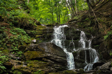 Water jets on rocks, Kamianetskyi Waterfall in forest, Synevyr, Transcarpathia, Ukraineの写真素材